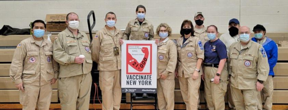 Assistant Professor Daniel Arellano, third from left, poses with other members of his DMAT at their vaccination deployment site in New York. (Photo courtesy Daniel Arellano. All pictured received same-day antigen testing and were negative for COVID-19.) Assistant Professor Daniel Arellano, third from left, poses with other members of his DMAT at their vaccination deployment site in New York. (Photo courtesy Daniel Arellano. All pictured received same-day antigen testing and were negative for COVID-19.)